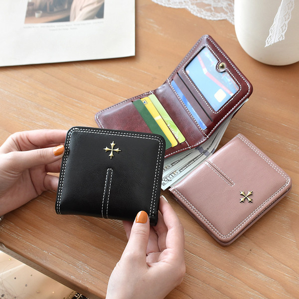 Portofel de dama din piele cu fermoar si element metalic