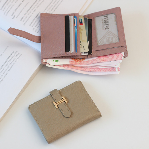 Portofel de dama modern cu inchidere metalica in patru culori