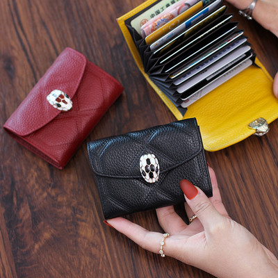 Γυναικείο έκο δερμάτινο πορτοφόλι με μεταλλική διακόσμηση σε διάφορα χρώματα