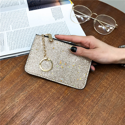 Naiste läikiv rahakott luku ja ripatsiga