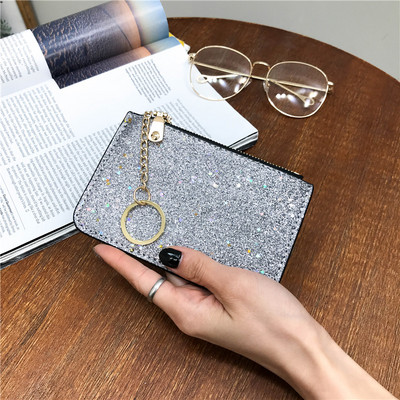 Naiste läikiv rahakott luku ja ripatsiga