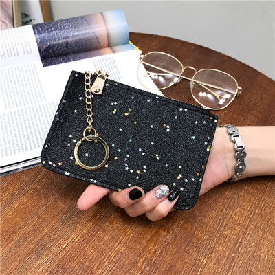 Naiste läikiv rahakott luku ja ripatsiga