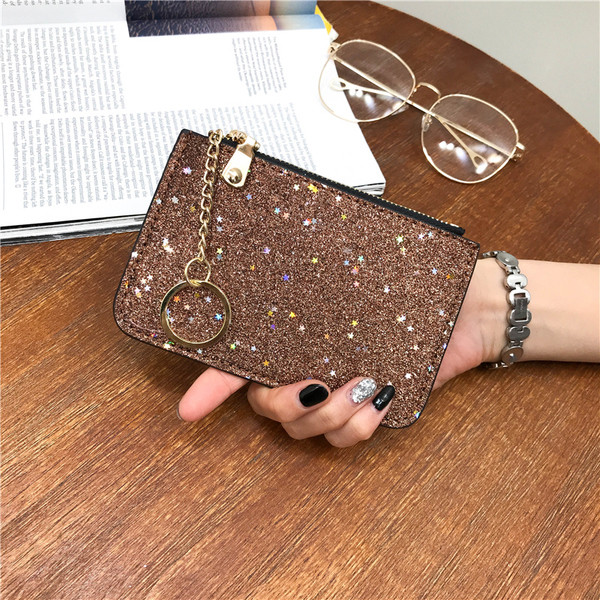 Naiste läikiv rahakott luku ja ripatsiga