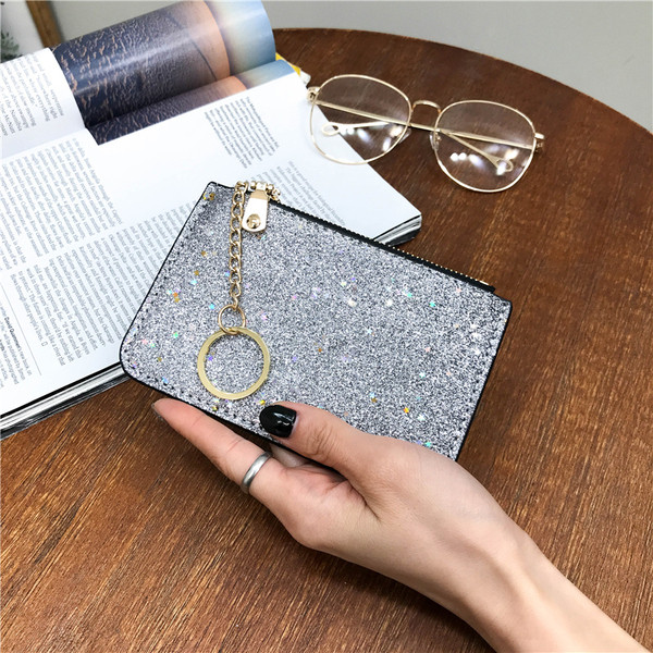 Naiste läikiv rahakott luku ja ripatsiga