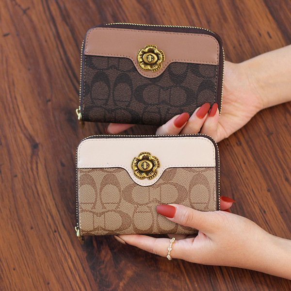 Kahes värvitoonis lukuga ja metallkaunistusega naiste rahakott