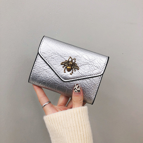 Aktuális női pénztárca fém elemmel