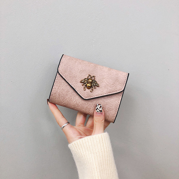 Aktuális női pénztárca fém elemmel