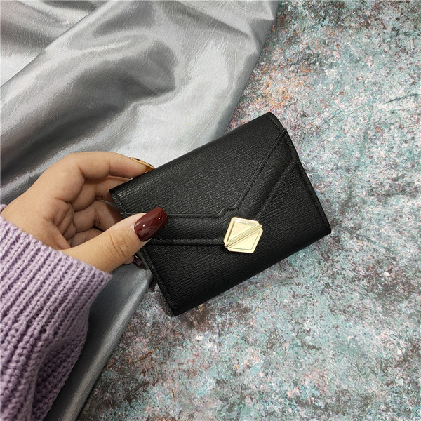 Eko bőrből készült stílusos női pénztárca fém rögzítéssel