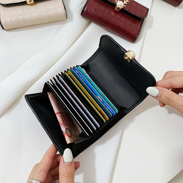 Női bőr pénztárca fém elemmel és gyöngyházzal