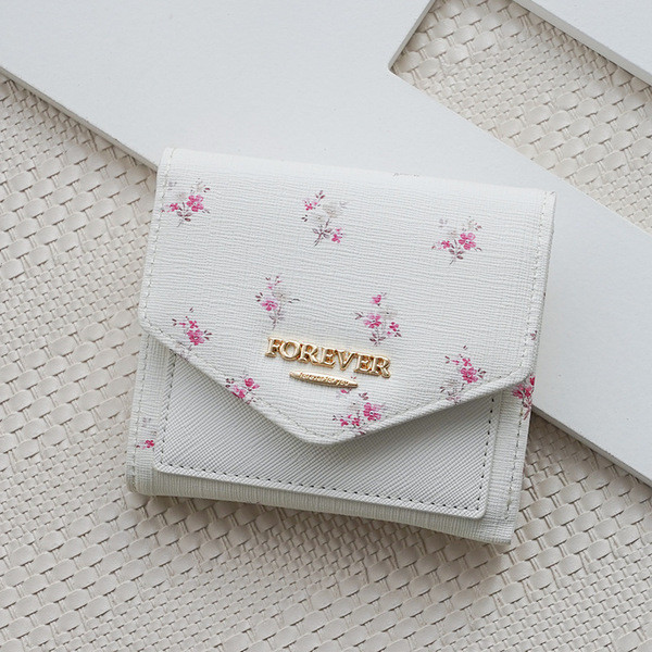 Naiste lillekott metallist kirjaga