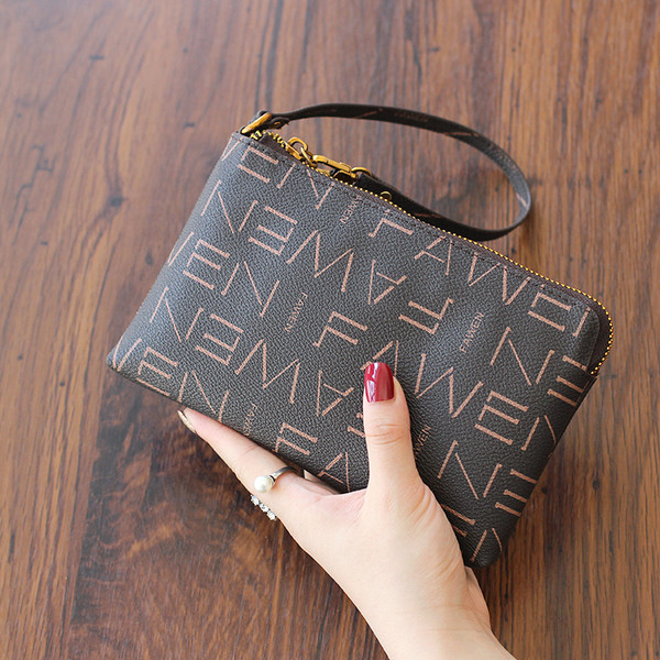 Naiste nahast rahakott luku ja nahast käepidemega