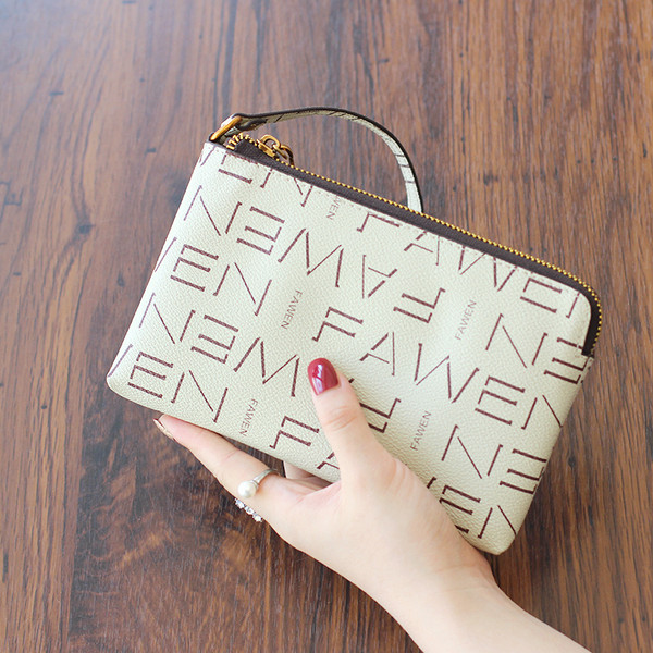 Naiste nahast rahakott luku ja nahast käepidemega