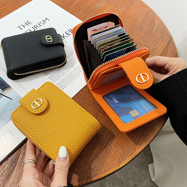 Mitmes värvitoonis lukuga naiste nahast rahakott