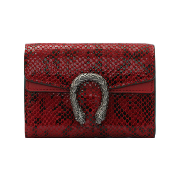 Női bőr pénztárca fém díszítéssel, állatmintával