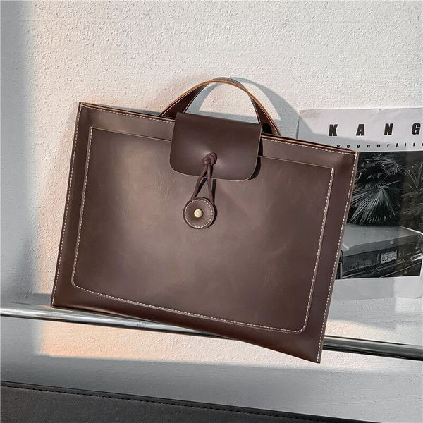 Kandilise kujuga ja pruuni värvi meeste nahast kott