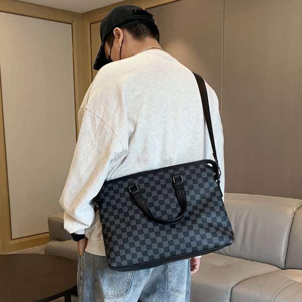 Stiilne sangadega nahast meeste kott