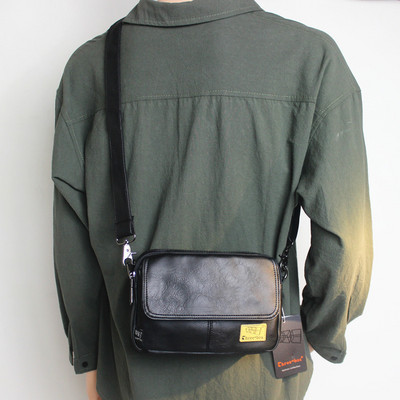 Kandilise kujuga tekstiilist sangaga meestekott