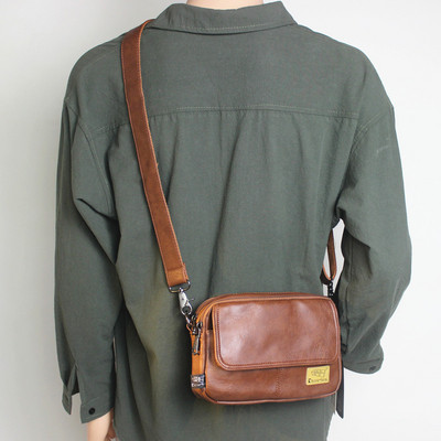 Kandilise kujuga tekstiilist sangaga meestekott