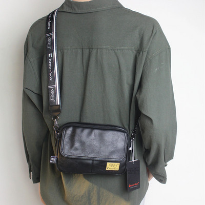 Kandilise kujuga tekstiilist sangaga meestekott