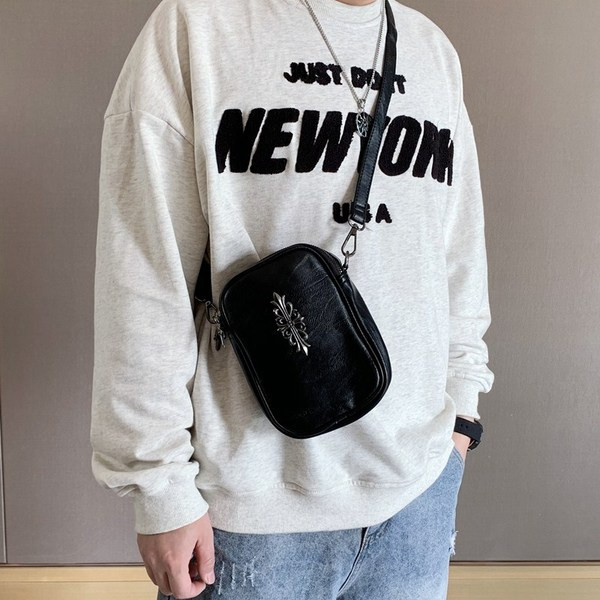 Pika sanga ja metallist kaunistusega vabaaja meeste nahkkott