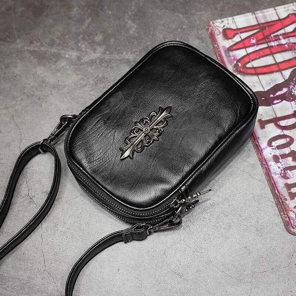 Pika sanga ja metallist kaunistusega vabaaja meeste nahkkott