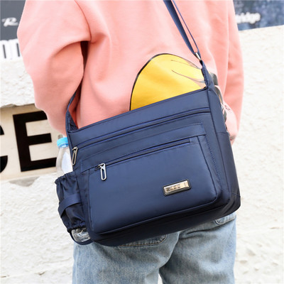 Meeste igapäevane kott luku ja embleemiga