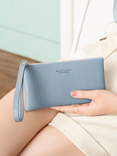 Napi női pénztárca cipzárral és műbőr fogantyúval