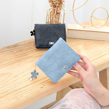 Γυναικείο μικρό πορτοφόλι κατασκευασμένο από έκο δέρμα με μεταλλικό στοιχείο