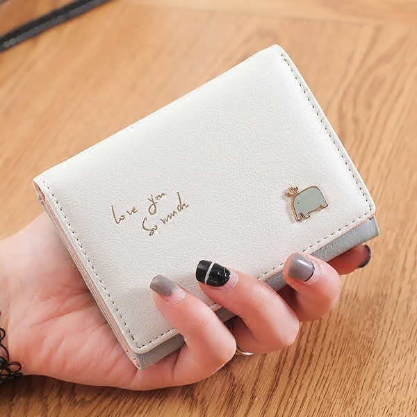 Väike nahast rahakott tikandi ja metallist kaunistusega - mitu mudelit