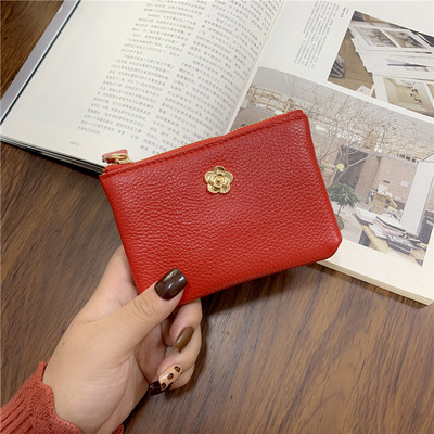 Γυναικείο πορτοφόλι με φερμουάρ και μεταλλικό στοιχείο σε διάφορα χρώματα