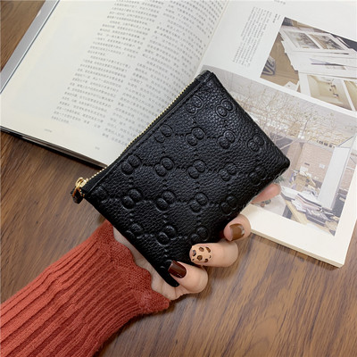 Γυναικείο πορτοφόλι με φερμουάρ και μεταλλικό στοιχείο σε διάφορα χρώματα