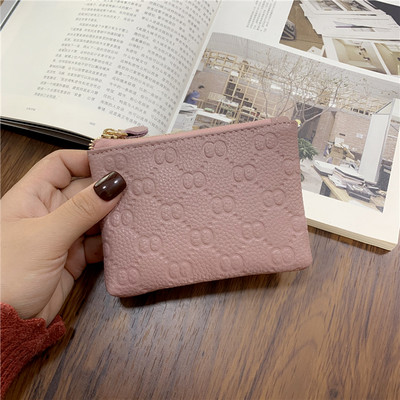 Γυναικείο πορτοφόλι με φερμουάρ και μεταλλικό στοιχείο σε διάφορα χρώματα