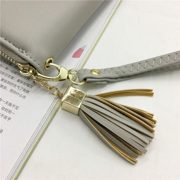 Πορτοφόλι νέο μοντέλο με φούντα και φερμουάρ σε διάφορα χρώματα