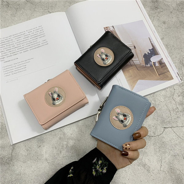 Női mindennapi pénztárca fém rögzítéssel és rátéttel