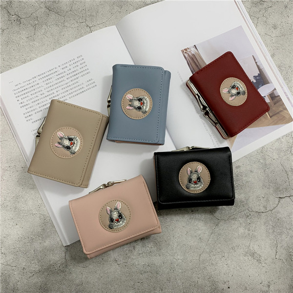 Női mindennapi pénztárca fém rögzítéssel és rátéttel