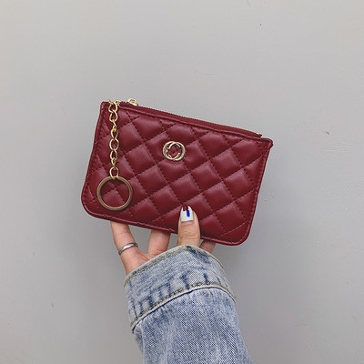 Női bőr pénztárca medállal és cipzárral