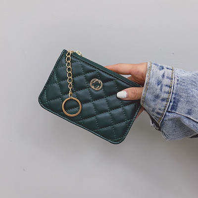 Női bőr pénztárca medállal és cipzárral