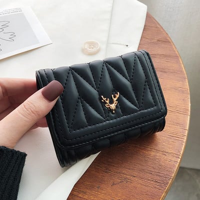 Női bőr pénztárca fém elemmel és cipzárral