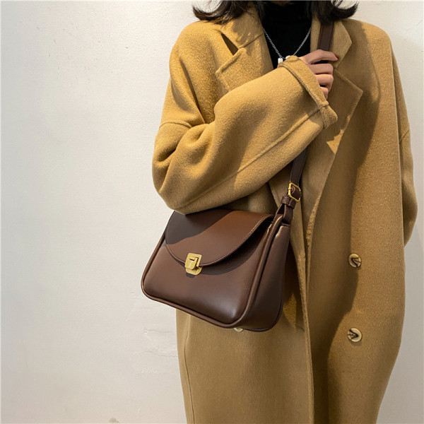 Ženska svakodnevna kožna torba s metalnim kopčanjem