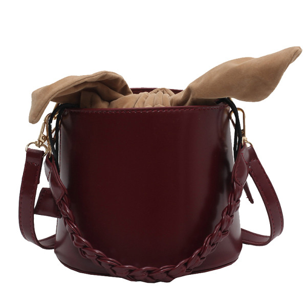 Kis méretű ökobőr táska textil résszel és két fogantyúval