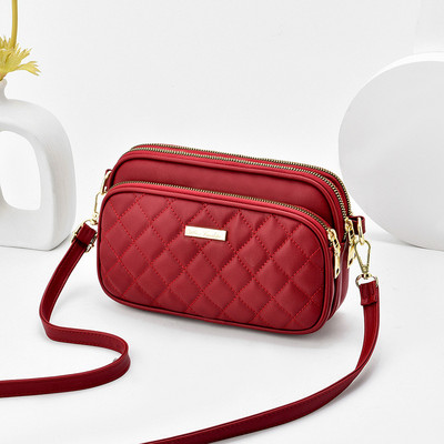 Eko bőrből készült alkalmi női táska cipzárral és hosszú füllel