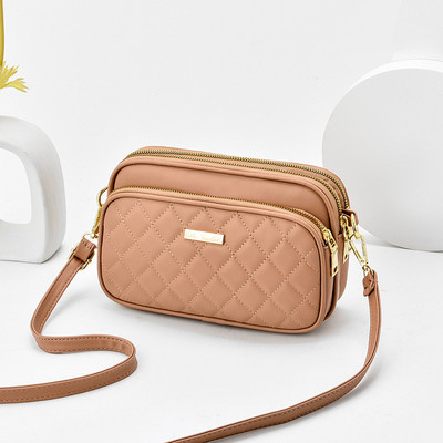 Eko bőrből készült alkalmi női táska cipzárral és hosszú füllel