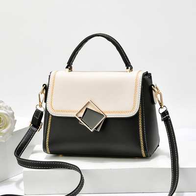 Moodne väike naistekott kunstnahast, metallelemendiga