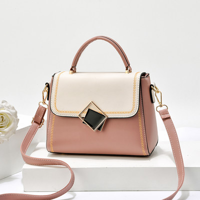 Moodne väike naistekott kunstnahast, metallelemendiga