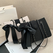 Σύγχρονη γυναικεία τσάντα με κορδέλα