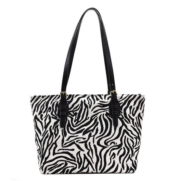 Naiste vabaajakott loomamustri ja nahast sangadega