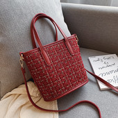 Mitmes värvitoonis mustriga naistekott