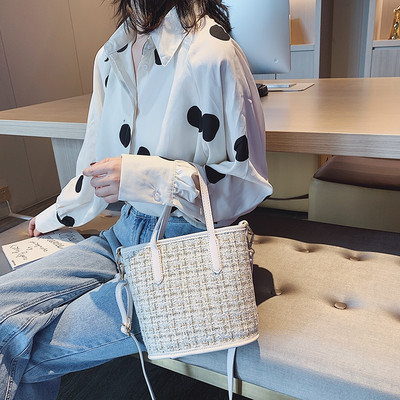 Mitmes värvitoonis mustriga naistekott