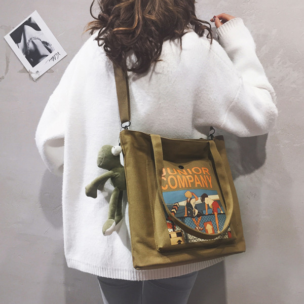 Naiste tekstiilist kott aplikatsiooni ja konnaripatsiga