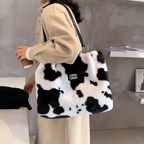 Naiste loomamustri ja nahast sangadega sulukott